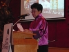 women speaking behind podium