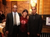 three people standing together for photo