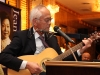 Dr. Ken Lumb playing guitar