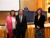 people standing next to large Onatrio heritage plaques dedicated to Jean Lumb