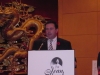 man speaking behind podium