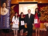 students holding their awards