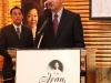 man speaking behind podium