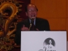 man speaking behind podium