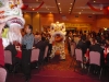 Chinese lion dancers in the aisles at large reception hall