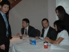 volunteers working behind table to register guests