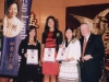 students holding their awards