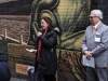 women speaking in laneway to crowd of attendees