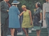 Jean Lumb and others greeting Queen Elizabeth with a curtsy