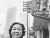 Jean smiling in front of her restaurant