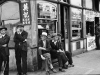 Chinese men hanging out on street corner