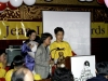Dora Nipp narrates the slide show presentation while standing behind podium