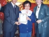 Jean Lumb handing award to male student recipient