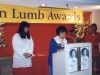 Jean Lumb speaking behind podium