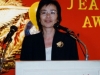 women speaking behind podium