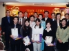 large group together for a photo, students are holding their awards