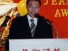 man speaking behind podium