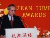 man speaking behind podium