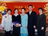 five people standing together for a photo