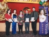 students standing next to Jean Lumb for picture