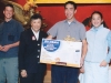 man holding prize, a microwave oven