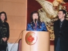 women speaking behind podium