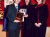 student being presented with award plaque
