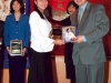 student being presented with award plaque