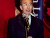 man speaking at podium