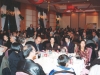 large banquet filled with people seated at dinner tables