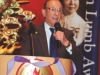man speaking at podium