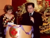 man and women speaking behind podium