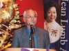 man speaking at podium