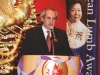 man speaking at podium