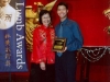student being presented with award plaque