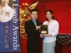 student being presented with award plaque