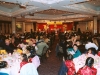 large banquet hall full of people seated at round tables