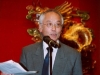 man speaking at microphone