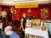 women spins gold raffle drum
