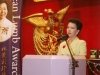 women speaking behind podium