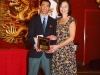 student being presented with award plaque