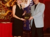 student being presented with award plaque