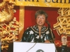 women speaking behind podium