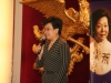 women speaking into microphone