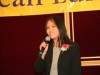 women speaking into microphone