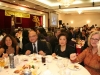 guests seated at round table for dinner, in banquet hall