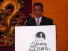 man speaking behind a podium