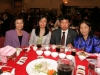 Guests at awards dinner eating at table