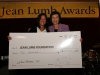 two people holding giant sized check from Laifun Designs