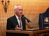 man speaking at podium